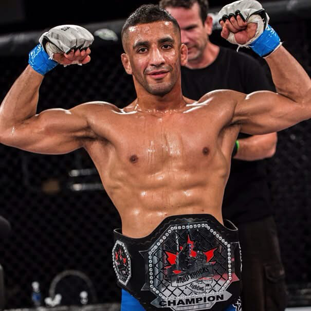 Coach Justin with championship belt