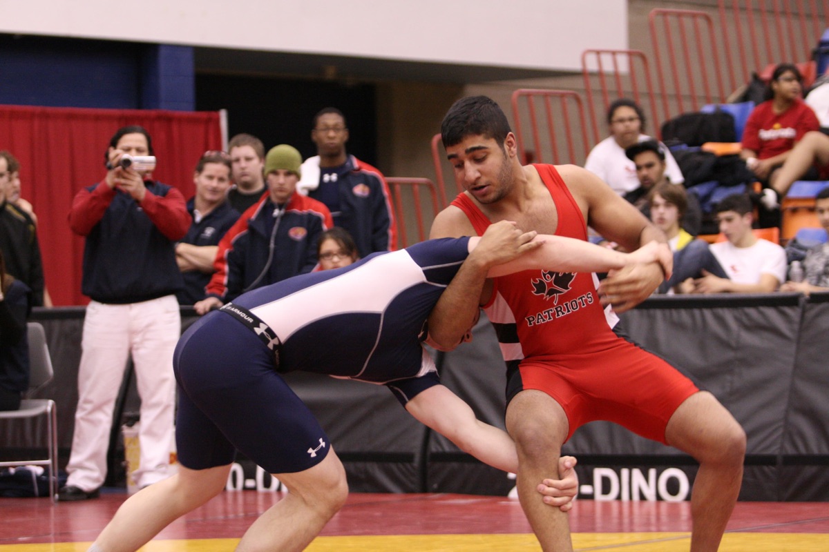 Coach Paul wrestling in competition
